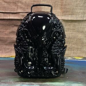 Alien Earth Giger biomechanical sci-fi xenomorph inspired backpack in burgundy